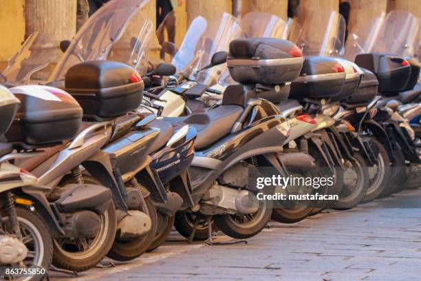 motorcycles parked in a row - marble stone yellow red stock pictures, royalty-free photos & images