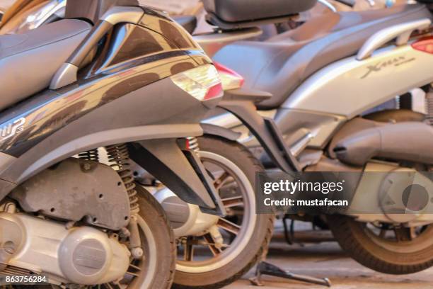 motorcycles parked in a row - marble stone yellow red stock pictures, royalty-free photos & images