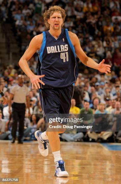 Dirk Nowitzki of the Dallas Mavericks reacts as he heads up court against the Denver Nuggets in Game One of the Western Conference Semifinals during...