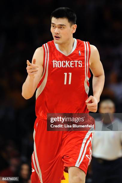 Yao Ming of the Houston Rockets points in the second half against the Los Angeles Lakers in Game One of the Western Conference Semifinals during the...