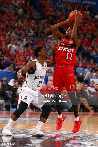 Bryce Cotton of the Wildcats takes a shot against Casper Ware of United during the round three NBL match between the Perth Wildcats and Melbourne...