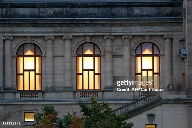 The lights are on in the building of the German Parliamentary Association where members of the delegations of the CDU/CSU conservative alliance, the...
