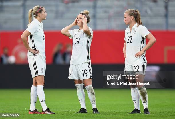 Lena Goessling of Germany, Svenja Huth of Germany and Tabea Kemme of Germany show their disappointment after the 2019 FIFA Women's World Championship...