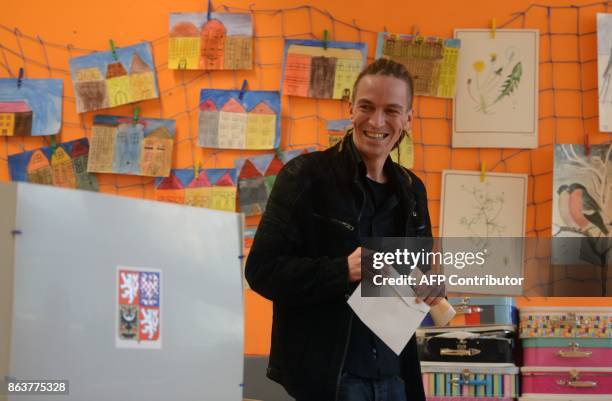 Ivan Bartos, chairman of the Czech pirate Party casts his ballot at a polling station during the first day of voting in the Czech elections on...