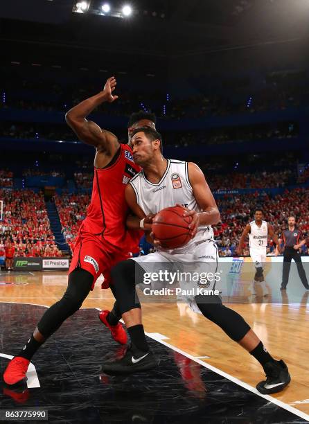 Tai Wesley of United drives into the keyway against Derek Cooke Jr. Of the Wildcats during the round three NBL match between the Perth Wildcats and...