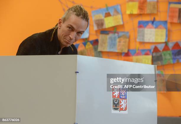 Ivan Bartos, chairman of the Czech pirate Party casts his ballot at a polling station during the first day of voting in the Czech elections on...