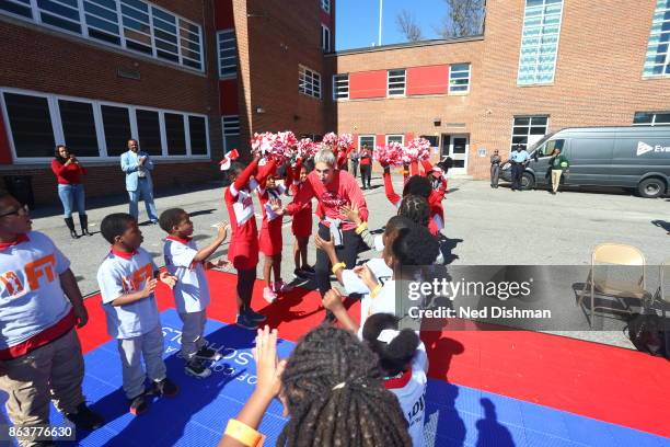 Elena Delle Donne of the Washington Mystics high fives kids of Hendley Elementary school during a court dedication on October 17, 2017 at Hendley...