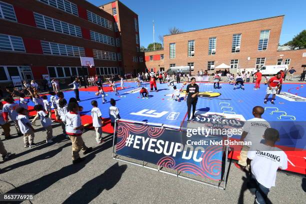 The Washington Mystics participates in a clinic at Hendley Elementary school during a court dedication and WNBA Fit Clinic on October 17, 2017 at...