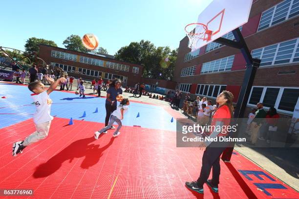 Tierra Ruffin-Pratt of the Washington Mystics participates in a clinic at Hendley Elementary school during a court dedication and WNBA Fit Clinic on...
