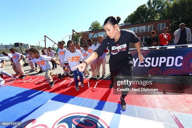 Natasha Cloud of the Washington Mystics participates in a clinic at Hendley Elementary school during a court dedication and WNBA Fit Clinic on...