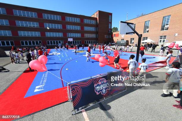 The Washington Mystics participates in a clinic at Hendley Elementary school during a court dedication and WNBA Fit Clinic on October 17, 2017 at...