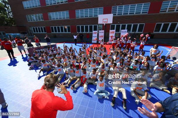 The Washington Mystics participates in a clinic at Hendley Elementary school during a court dedication and WNBA Fit Clinic on October 17, 2017 at...