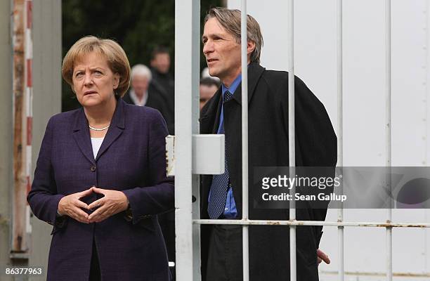 German Chancellor Angela Merkel arrives to tour the former prison of the East German, communist-era secret police, known as the Stasi, at...