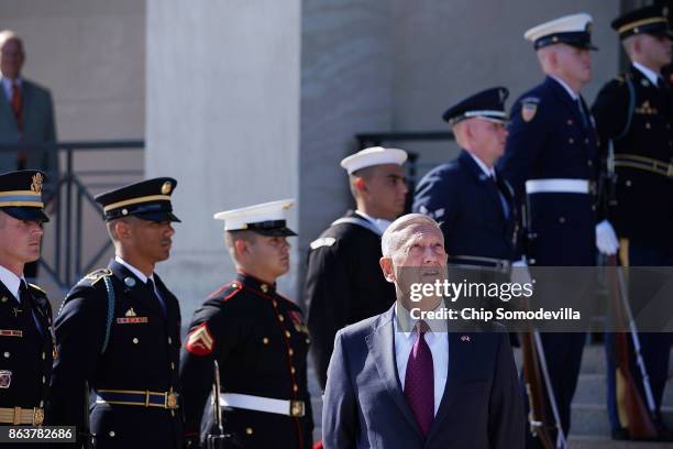 Defense Secretary James Mattis waits on France's Minister of the Armed Forces Florence Parly ahead of an enhanced honor cordon at the Pentaon October...