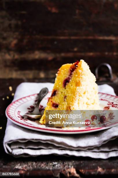 homemade lemon cake with candied lemon sliced fruit in a bowl on a wooden table, selective focus - clotted cream stock pictures, royalty-free photos & images