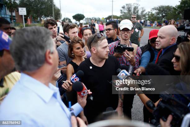 Self-described white nationalist Colton Fears, of Pasadena, Texas, speaks to members of the media as demonstrators gather near the site of a planned...
