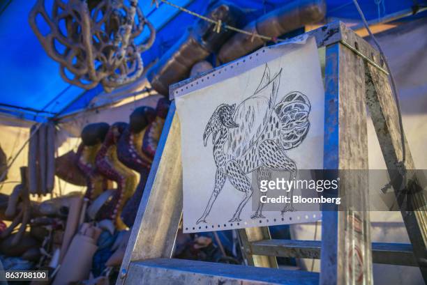 Sketch of an alebrijee, Mexican folk art sculpture, by artist Ricardo Linares hangs on display at his studio in Mexico City, Mexico, on Wednesday,...
