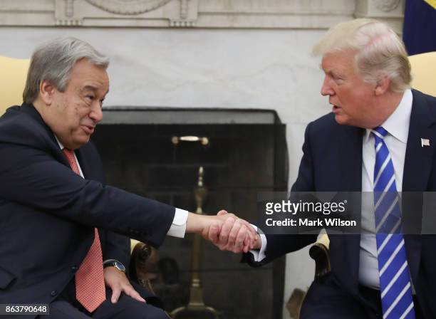 President Donald Trump shakes hands with UN Secretary General António Guterres during a meeting in the Oval office at the White House on October 20,...