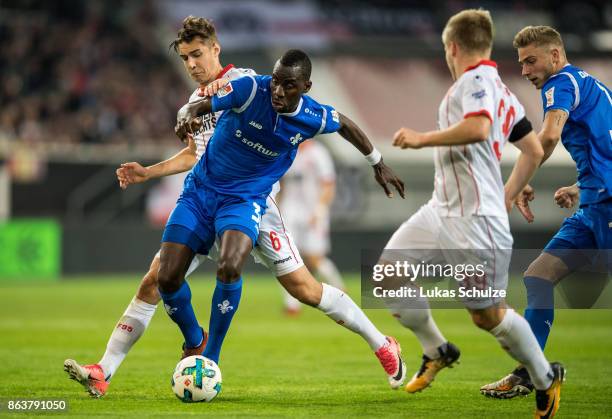 Florian Neuhaus of Duesseldorf and Wilson Kamavuaka Wilson Kamavuaka of Darmstadt fight for the ball during the Second Bundesliga match between...