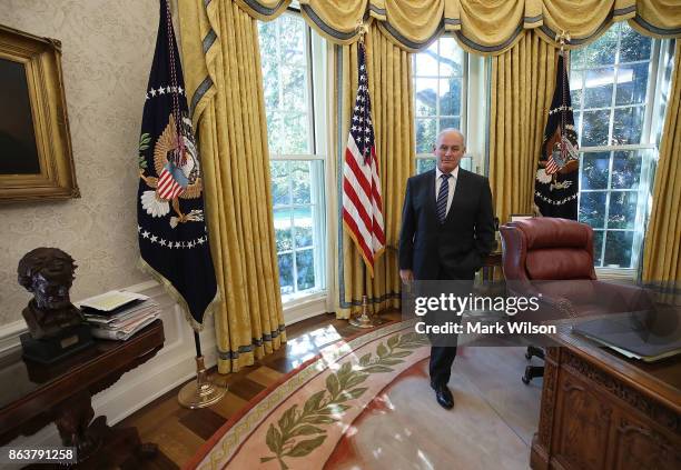 White House Chief of Staff John Kelly stands in the Oval Office while President Donald Trump meets with UN Secretary General António Guterres, at the...