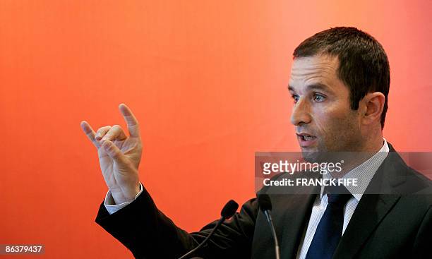 French socialist Party's spokesman Benoit Hamon gestures as he delivers a speech during a press conference, on May 5 in Paris, as French president...
