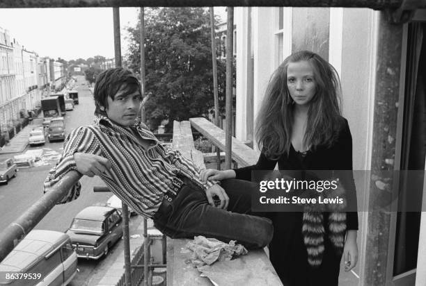 English photographer David Bailey with model Penelope Tree in London, circa 1967.