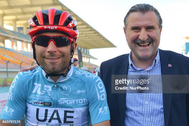 Diego Ulissi from UAE Team Emirates poses for a picture with Osman Askn Bak, the Minister of Youth and Sports of the Republic of Turkey, ahead to the...