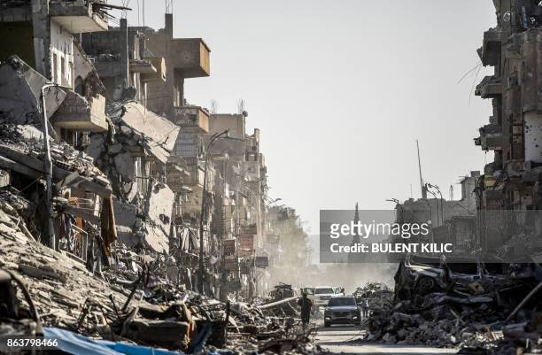 Picture taken on October 20 shows a general view of heavily damaged buildings in Raqa, after a Kurdish-led force expelled Islamic State group...