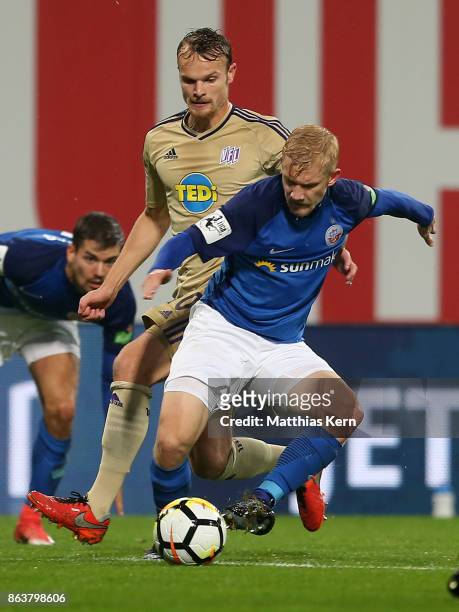 Bryan Henning of Rostock battles for the ball with Christian Gross of Osnabrueck during the third league match between FC Hansa Rostock and VfL...