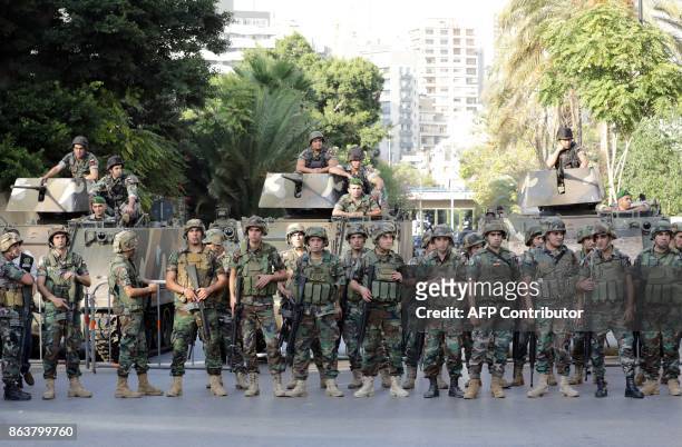 Lebanese soldiers stand at attention during a demonstration by Members and supporters of the Syrian Social Nationalist Party in front of the Court of...