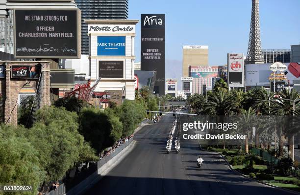 Marquees display support for Las Vegas Metropolitan Police Department Officer Charleston Hartfield during a motorcade on the Las Vegas Strip...