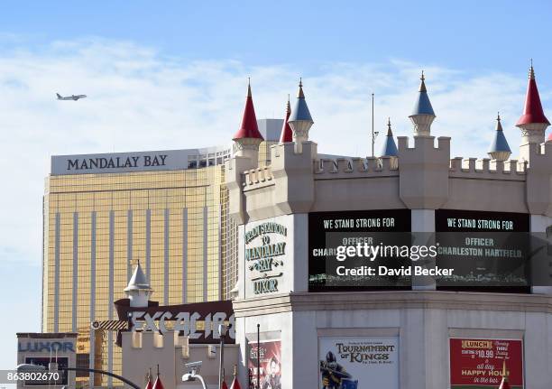 Marquees display support for Las Vegas Metropolitan Police Department Officer Charleston Hartfield during a motorcade on the Las Vegas Strip...