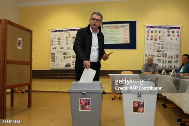 Social Democrat leader Lubomir Zaoralek casts his ballot at a polling station during the first day of voting in the Czech elections on October 20,...