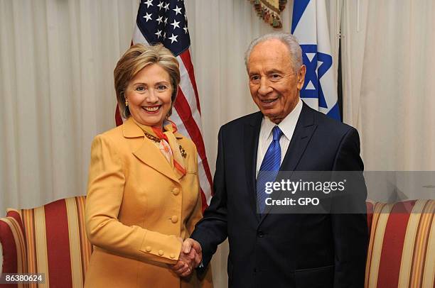 In this handout image supplied by the Israeli Government Press Office , Israeli President Shimon Peres meets with Secretary of State Hillary Clinton,...