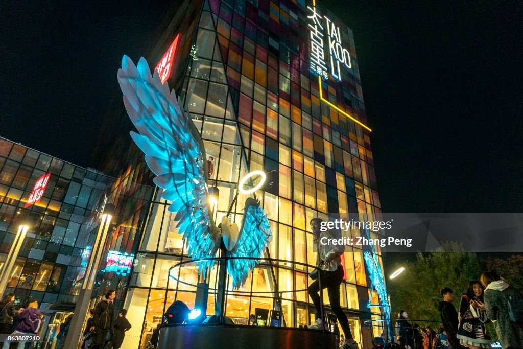 A light show of angel wings on the square of Sanlitun...