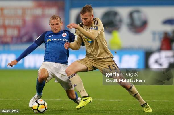 Stefan Wannenwetsch of Rostock battles for the ball with Jules Reimerink of Osnabrueck during the third league match between FC Hansa Rostock and VfL...