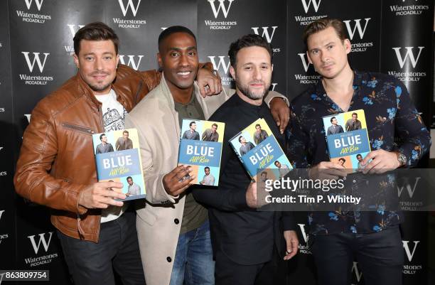 Duncan James, Simon Webbe, Anthony Costa and Lee Ryan from boy band Blue signing copies of the bands new book 'Blue: All Rise: Our Story' at...