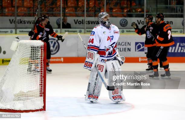 Dennis Endras, goaltender of Mannheim looks dejected while player of Wolfsburg celebrate the 3rd goal during the DEL match between Grizzlys Wolfsburg...
