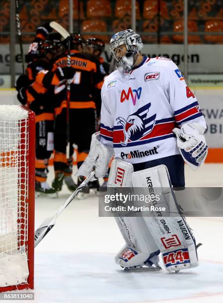 Dennis Endras, goaltender of Mannheim looks dejected while player of Wolfsburg celebrate the 3rd goal during the DEL match between Grizzlys Wolfsburg...