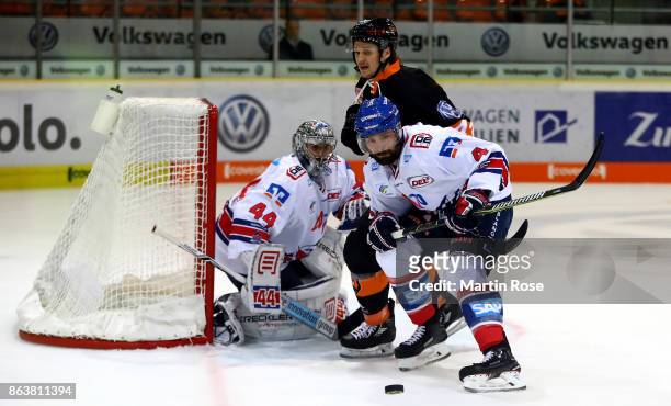 Alexander Wiess of Wolfsburg and Mark Stuart of Mannheim battle for the puck during the DEL match between Grizzlys Wolfsburg and Adler Mannheim at...