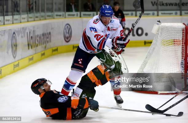 Sebastian Furchner of Wolfsburg and Denis Reul of Mannheim battle for the puck during the DEL match between Grizzlys Wolfsburg and Adler Mannheim at...