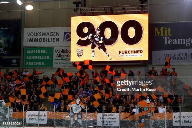 Sebastian Furchner of Wolfsburg is honored for 900 DEL matches before the DEL match between Grizzlys Wolfsburg and Adler Mannheim at Eisarena...