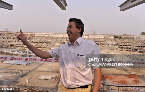 Indian hockey coach Jose Brasa gestures during his visit to the Dhyan Chand National Stadium to inspect the ongoing work for the 2010 commonwealth...
