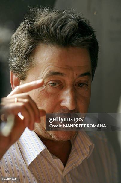 Indian hockey coach Jose Brasa gestures during his visit to the Dhyan Chand National Stadium to inspect the ongoing work for the 2010 commonwealth...