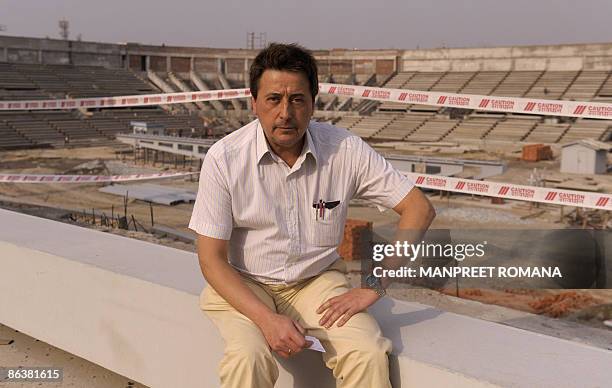 Indian hockey coach Jose Brasa poses during his visit to the Dhyan Chand National Stadium to inspect the ongoing work for the 2010 commonwealth...