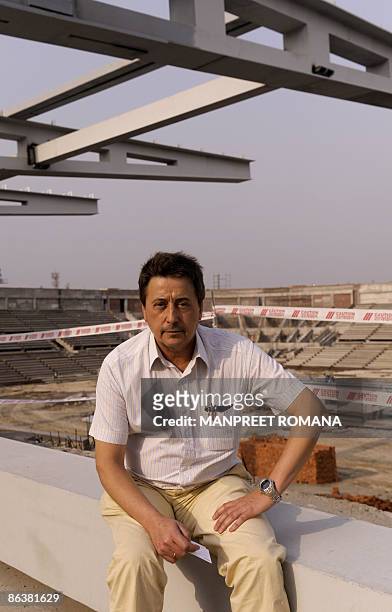 Indian hockey coach Jose Brasa poses during his visit to the Dhyan Chand National Stadium to inspect the ongoing work for the 2010 commonwealth...