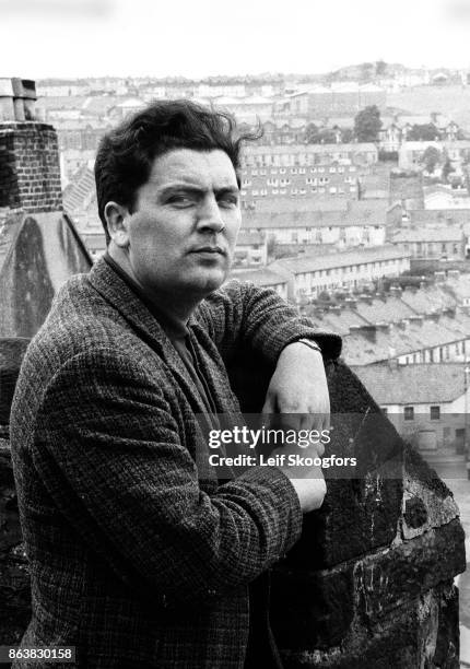 Portrait of Irish politician John Hume as he poses on a rooftop that overlooks the Catholic Bogside neighborhood, Londonderry , Northern Ireland,...