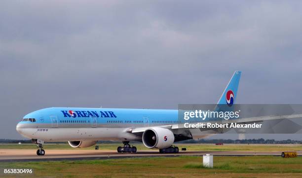 Korean Air Boeing 777 passenger jet taxis at the Dallas/Fort Worth International Airport, located roughly halfway between Dallas and Fort Worth,...