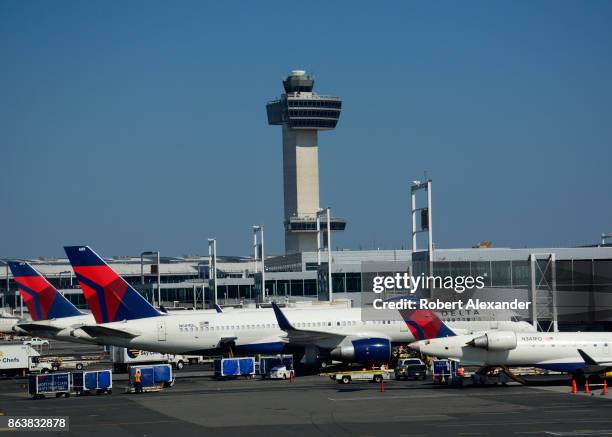 Delta Airlines Boeing 777 passenger jets are serviced at John F. Kennedy International Airport in New York, New York, with the airport's 32 story,...