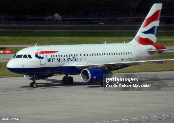 British Airways passenger jet taxis at Heathrow International Airport in London, England.